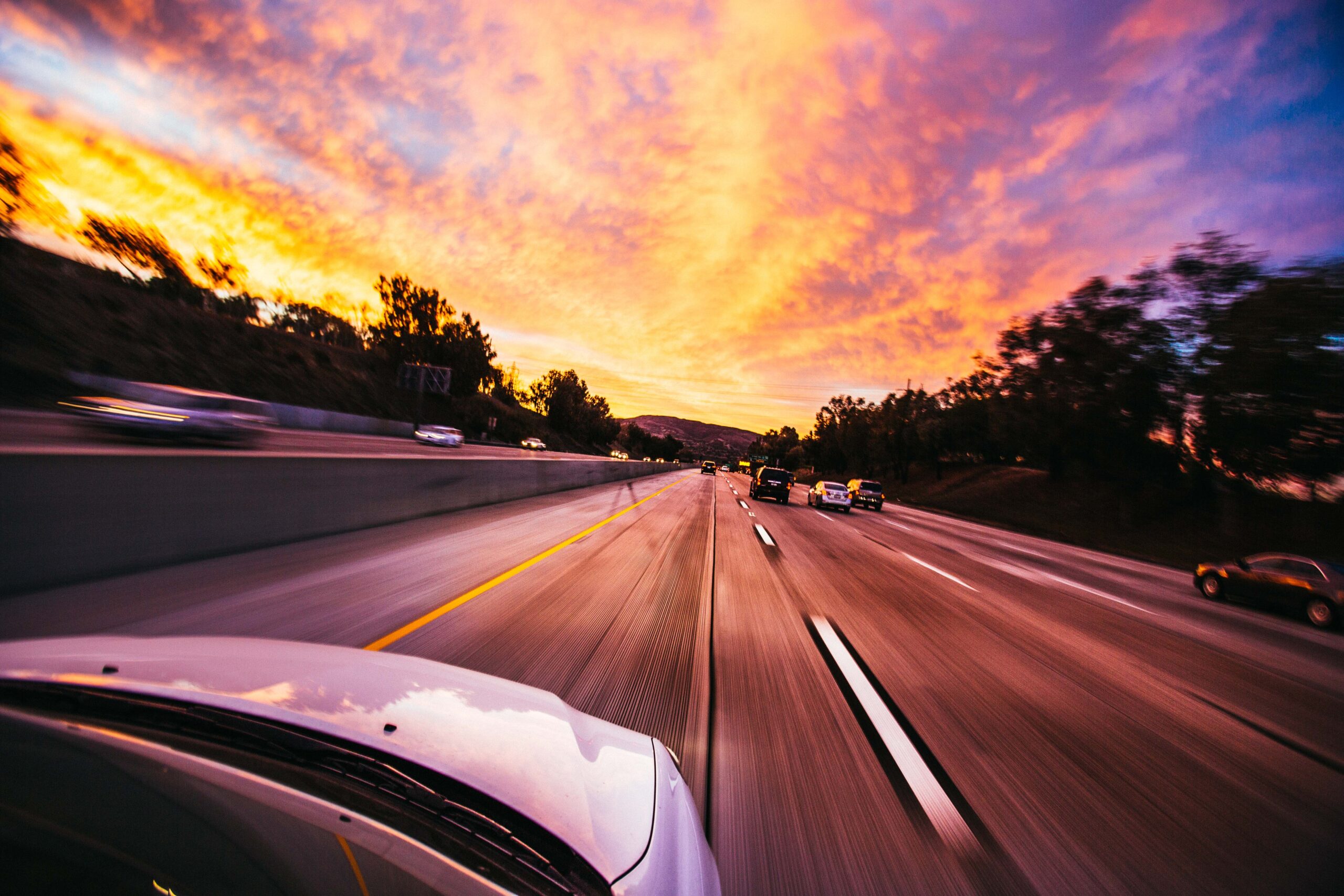 driving on highway sunset