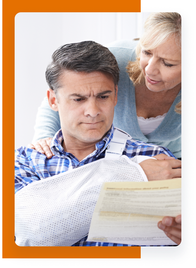 injured Client looking at medical bills after car accident