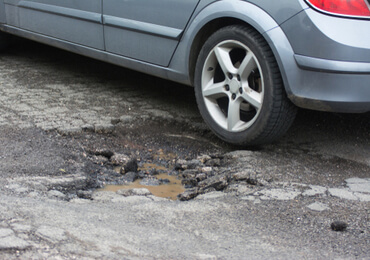 premises liability cracked pavement pothole