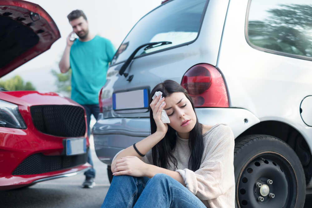 Female driver injured at car accident.