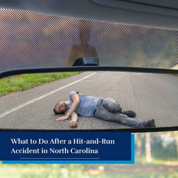 Person on the street viewed through a rearview mirror