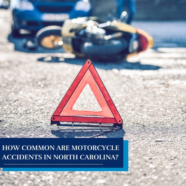 Warning triangle in front of a motorcycle accident scene